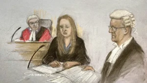 Lucy Letby (center) is shown hearing evidence in a courtroom sketch on Friday.Elizabeth Cook/AP